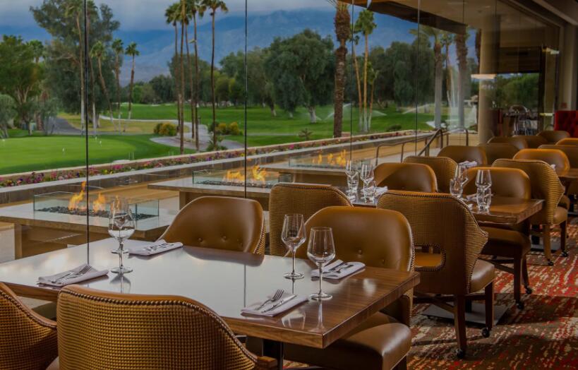 6 Via Santa Ramona Rancho Mirage, CA 92270 - Photo 55 of 60 a view of a patio with table and chairs potted plants with wooden floor and fence