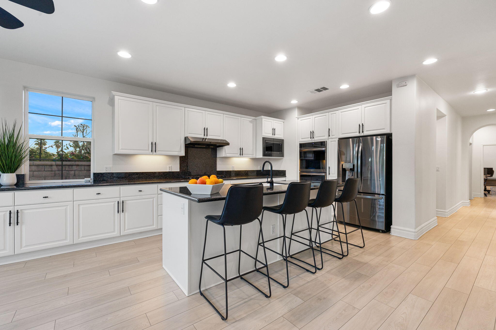 6 Via Santa Ramona Rancho Mirage, CA 92270 - Photo 9 of 60 a kitchen with stainless steel appliances kitchen island granite countertop a refrigerator and microwave