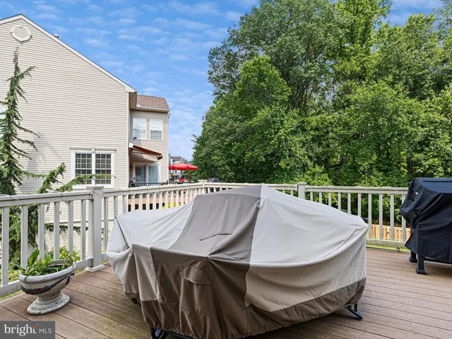 a view of balcony with wooden floor and seating space