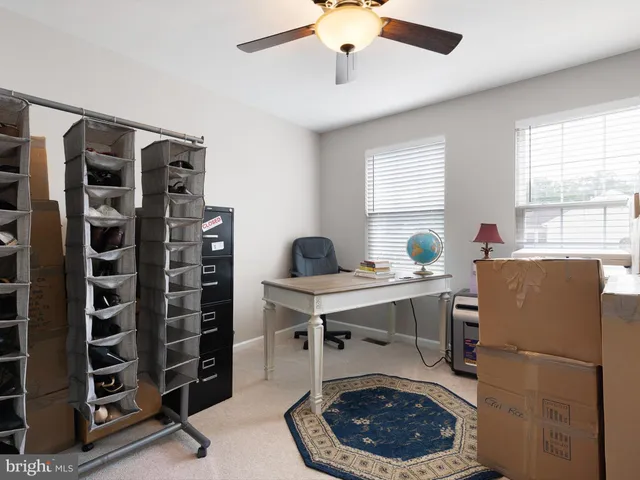 a workspace with furniture and window