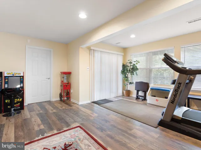 a view of a livingroom with furniture and a flat screen tv
