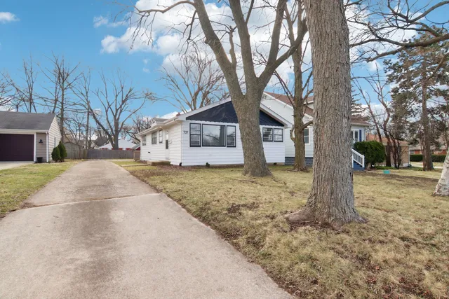 a house with trees in front of it