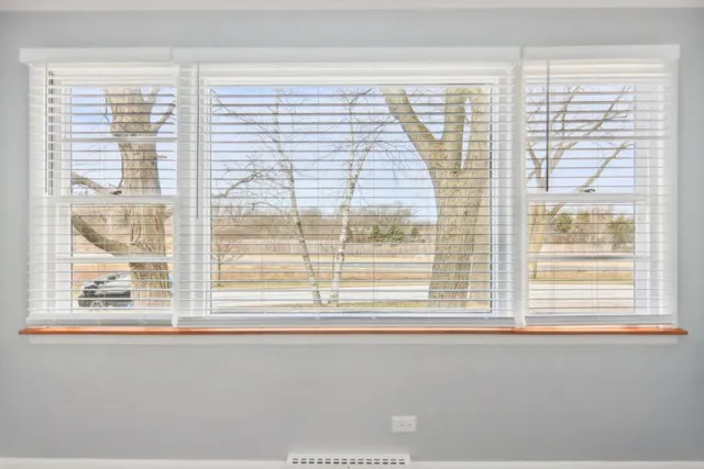 a kitchen with a refrigerator sink and cabinets