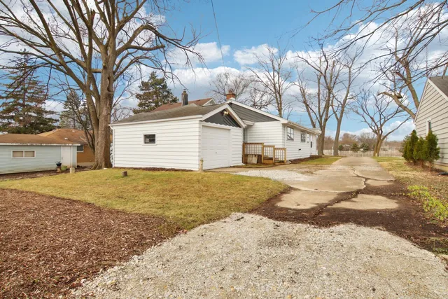 a view of a yard and an ocean view