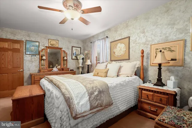 a bed room with a bed and dresser