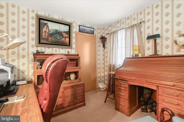 a bedroom with a bed and a flat tv screen