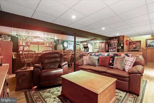 a living room with furniture a large window with outer view