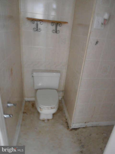 2102 Graythorn Road Middle River, MD 21220 - Photo 11 of 18 a white toilet sitting next to a shower
