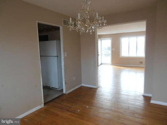 2102 Graythorn Road Middle River, MD 21220 - Photo 6 of 18 a view of a big room with wooden floor and chandelier