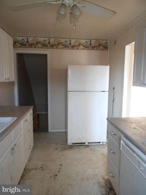 2102 Graythorn Road Middle River, MD 21220 - Photo 8 of 18 a utility room with cabinets washer and dryer