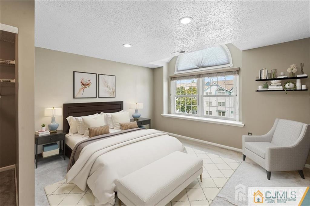 834 Edpas Road New Brunswick, NJ 08901 - Photo 17 of 20 a bedroom with a bed and glass window