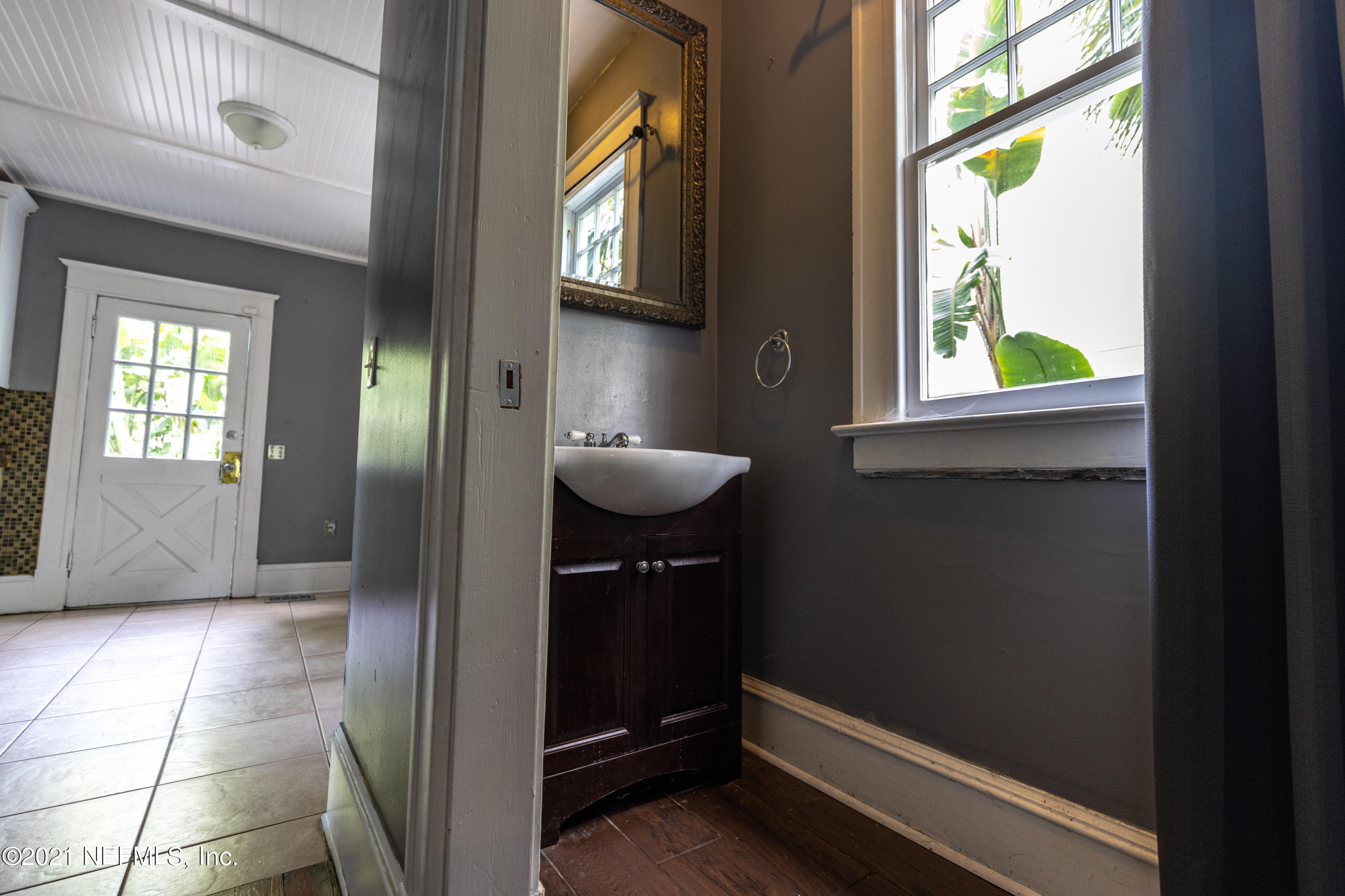 1532 Perry Street Jacksonville, FL 32206 - Photo 11 of 58 a bathroom with a sink and a mirror