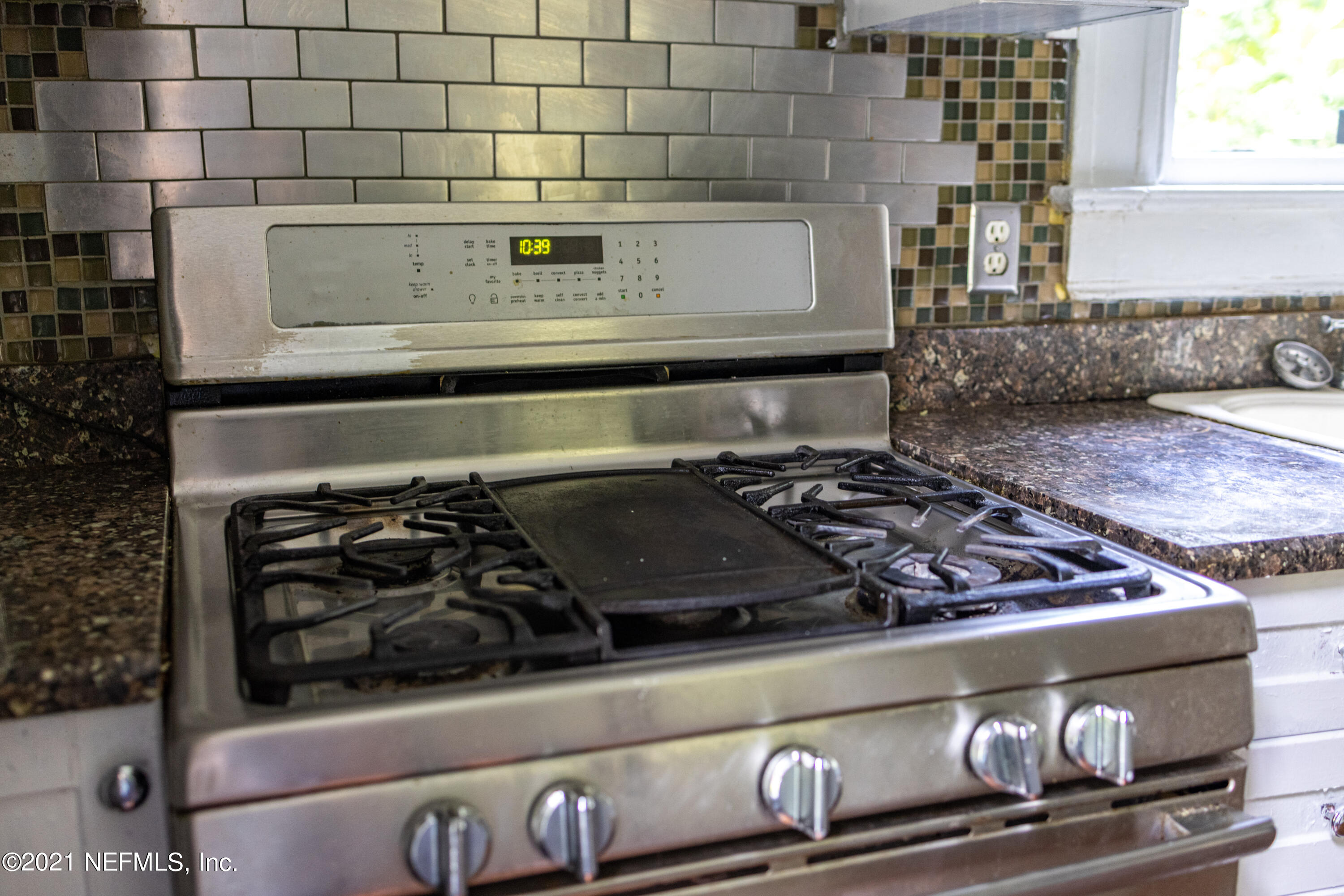 1532 Perry Street Jacksonville, FL 32206 - Photo 14 of 58 a close view of a stove a microwave and a counter top
