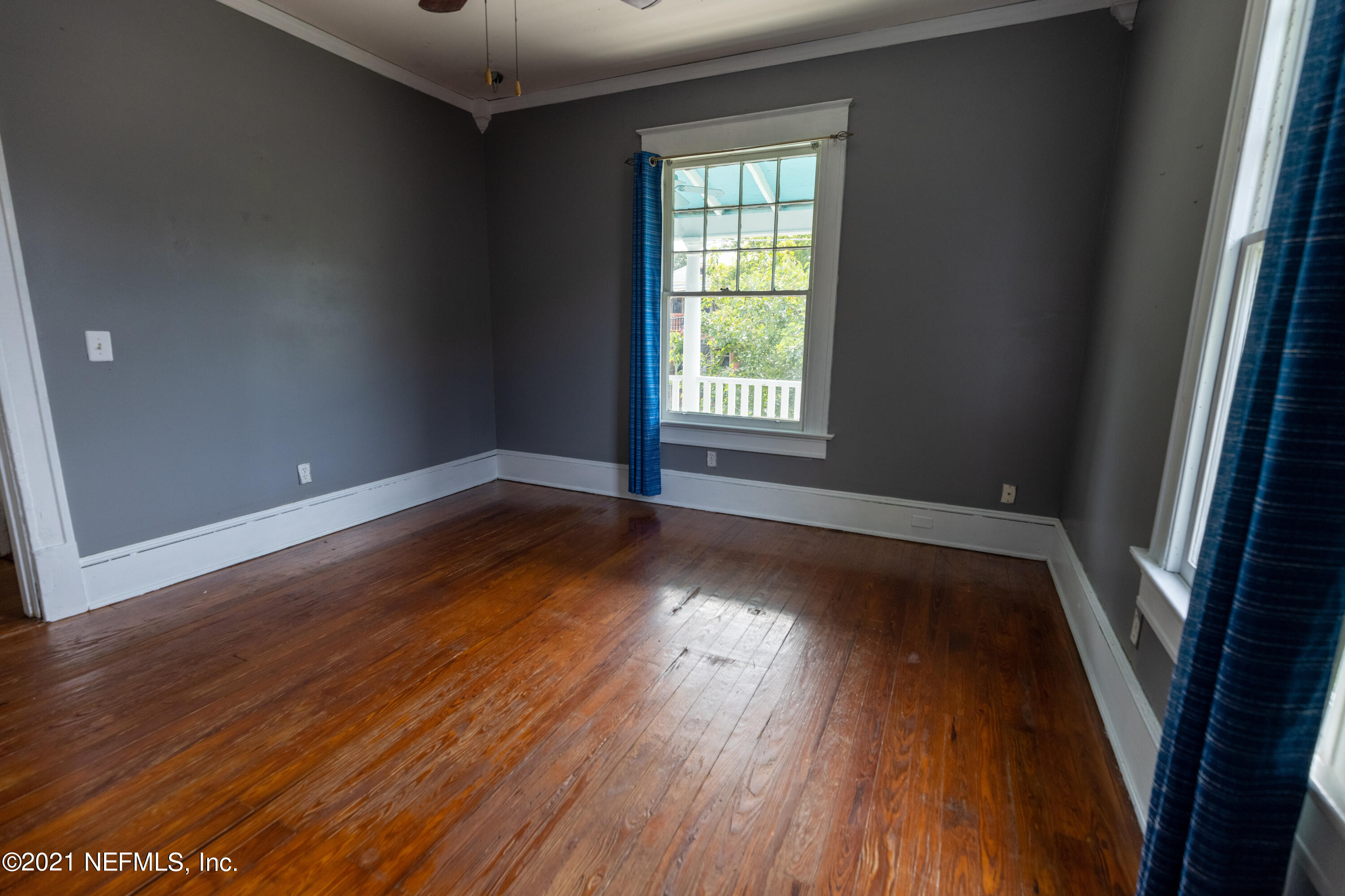 1532 Perry Street Jacksonville, FL 32206 - Photo 23 of 58 an empty room with wooden floor and windows