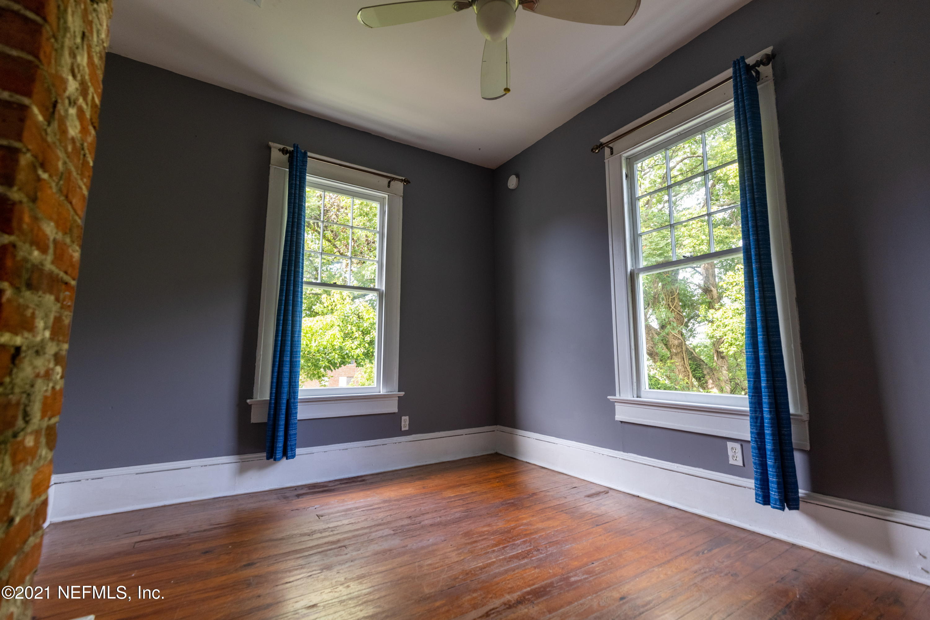 1532 Perry Street Jacksonville, FL 32206 - Photo 28 of 58 a view of an empty room with wooden floor and a window