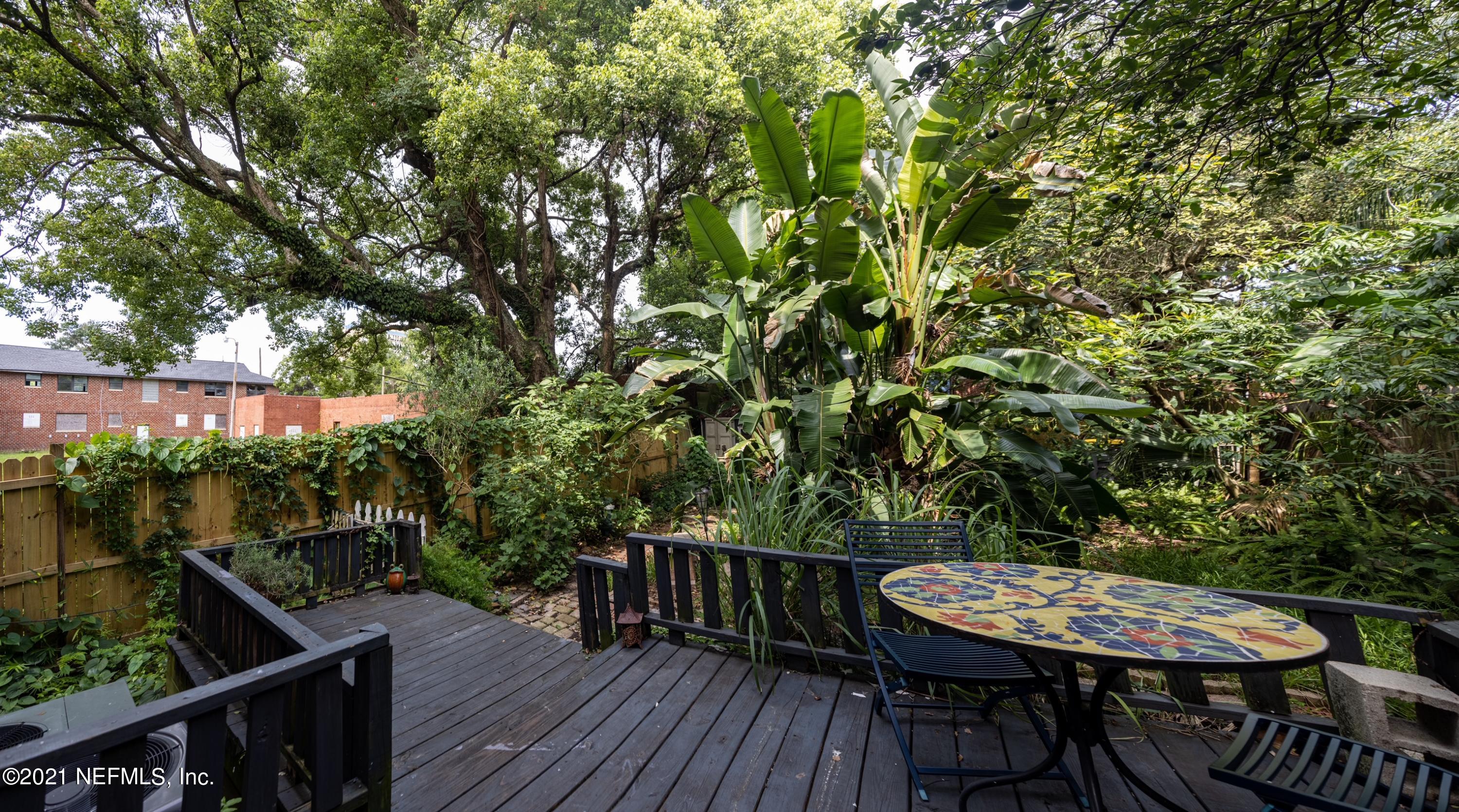 1532 Perry Street Jacksonville, FL 32206 - Photo 36 of 58 a balcony with wooden floor and outdoor seating