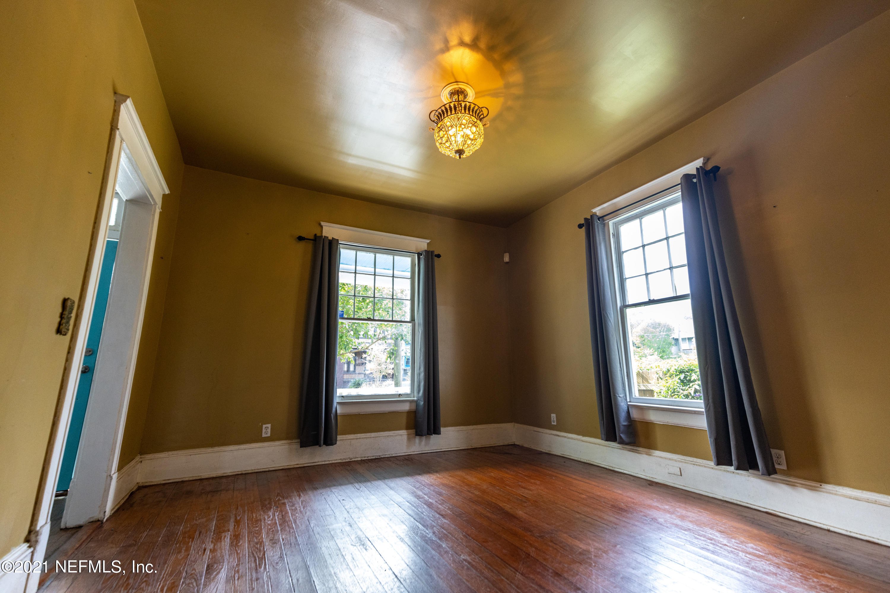 1532 Perry Street Jacksonville, FL 32206 - Photo 7 of 58 a view of an empty room with a window and wooden floor