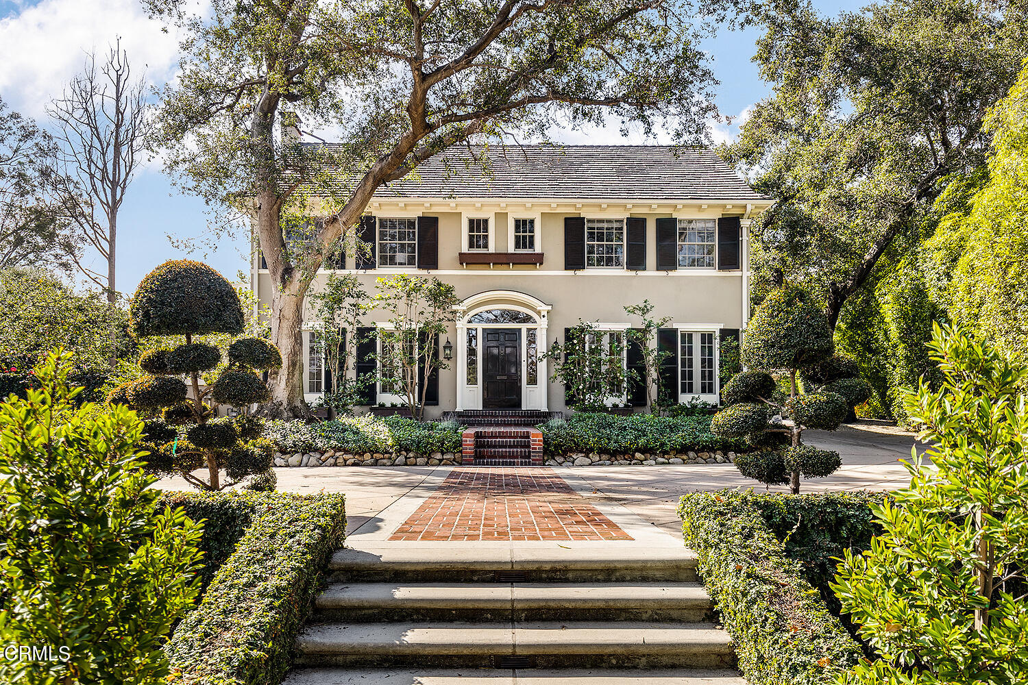 1477 Old Mill Road San Marino, CA 91108 - Photo 1 of 3 a front view of a house with fountain and porch