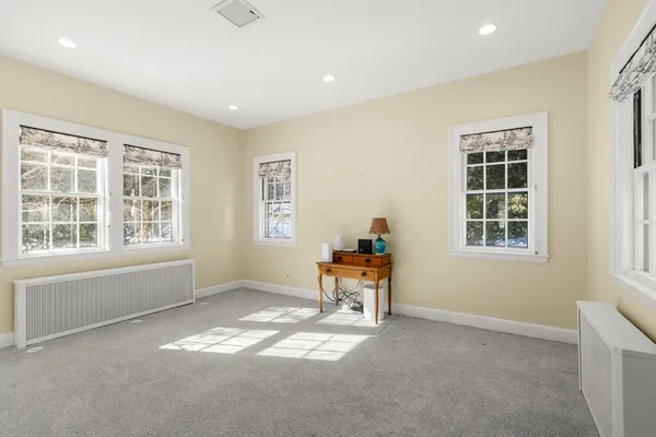 a bathroom with a sink a toilet and a shower curtain