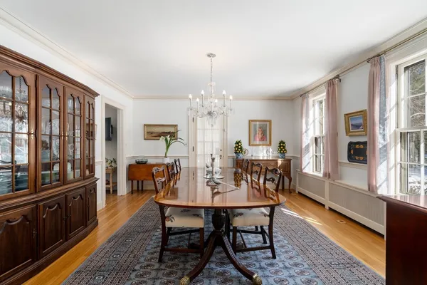 a view of a dining room with furniture and window