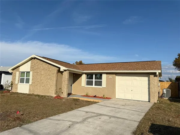 a front view of a house with a garage
