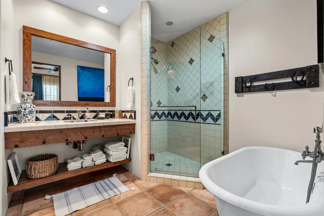 a bathroom with a bathtub and a shower