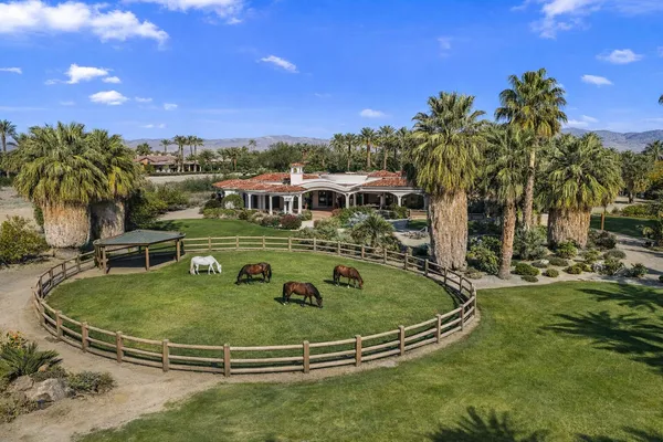 a view of a swimming pool with a yard