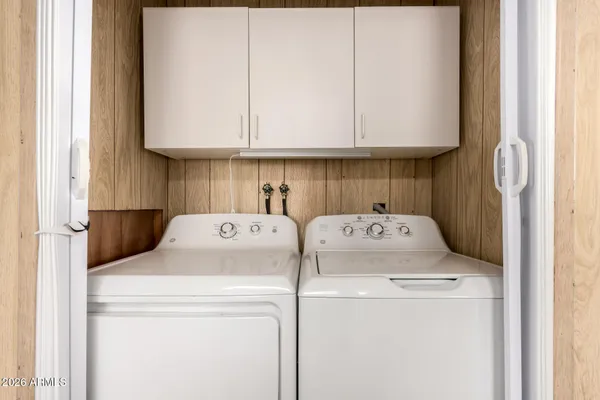 a utility room with dryer and washer