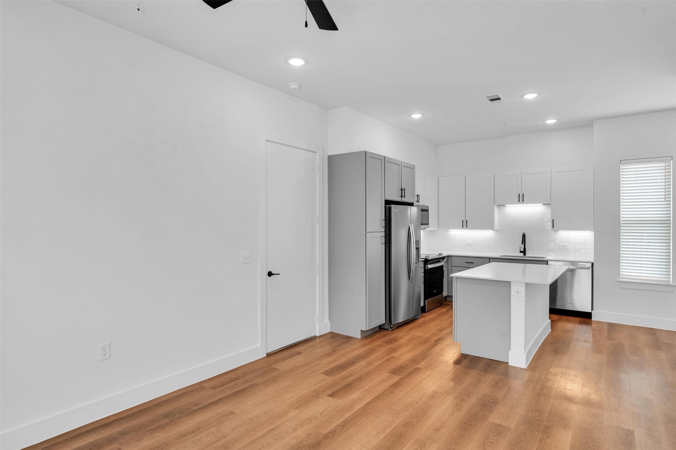 1433 B Soccer Drive Little Elm, TX 75068 - Photo 2 of 38 a kitchen with a refrigerator and a stove top oven