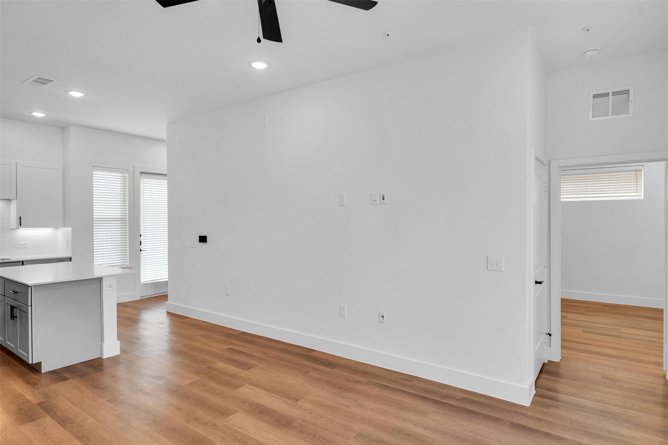 1433 B Soccer Drive Little Elm, TX 75068 - Photo 6 of 38 wooden floor in an empty room with a window