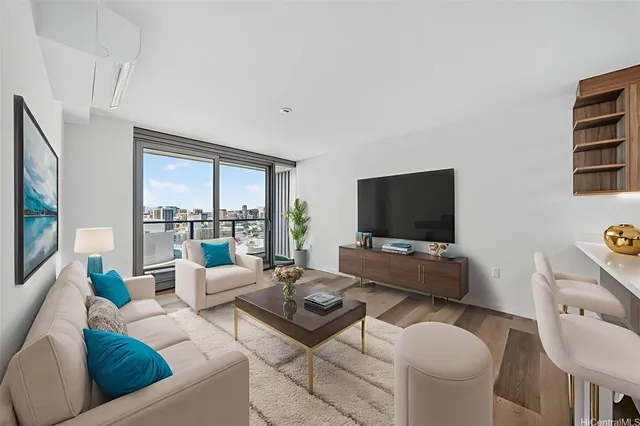 a living room with furniture and a flat screen tv