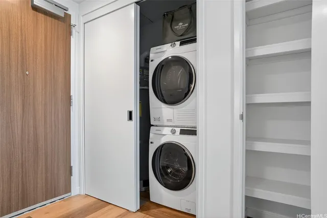 a view of a hallway with washer and dryer