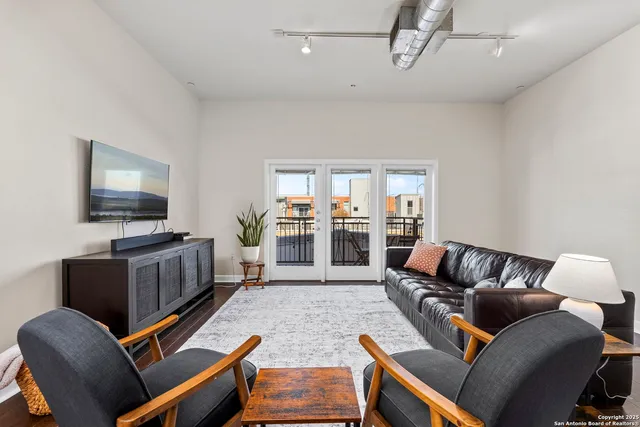 a view of a balcony with a table and chairs