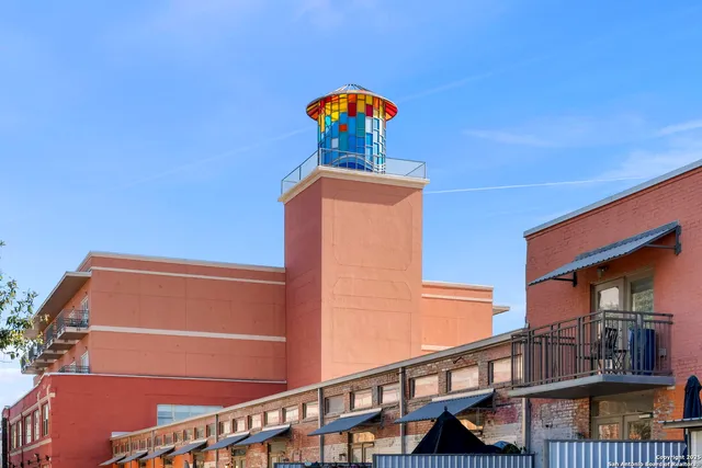 an aerial view of a building with a ocean view