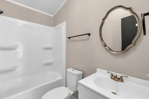 a view of a bathroom with a toilet and a shower