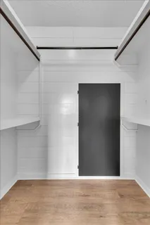 a bathroom with a granite countertop toilet a sink and a mirror