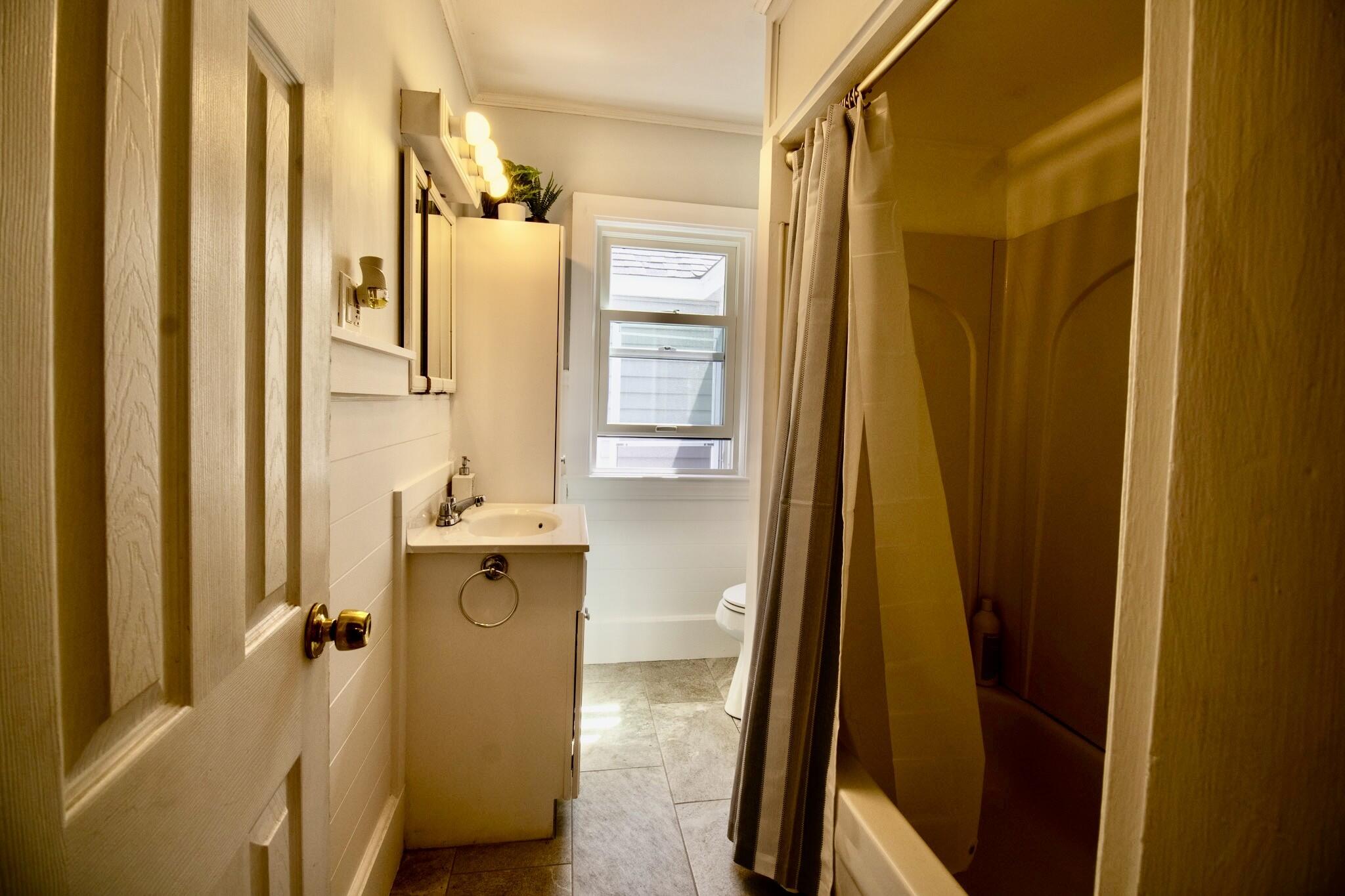 106 County Road East Freetown, MA 02717 - Photo 6 of 18 a bathroom with a tub a sink and mirror