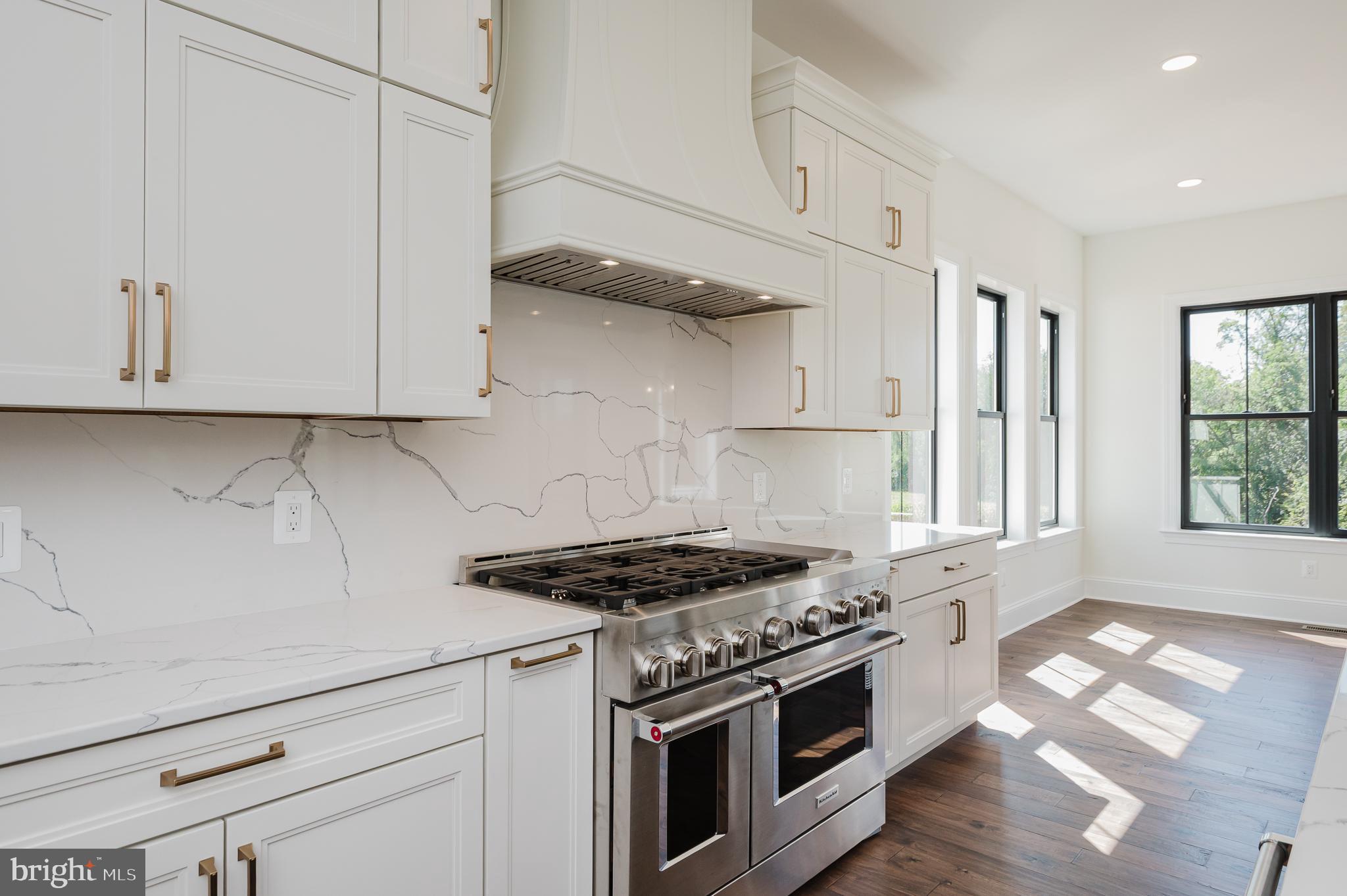 1709 Laurel Brook Road Fallston, MD 21047 - Photo 21 of 83 a kitchen with stainless steel appliances granite countertop white cabinets and a stove