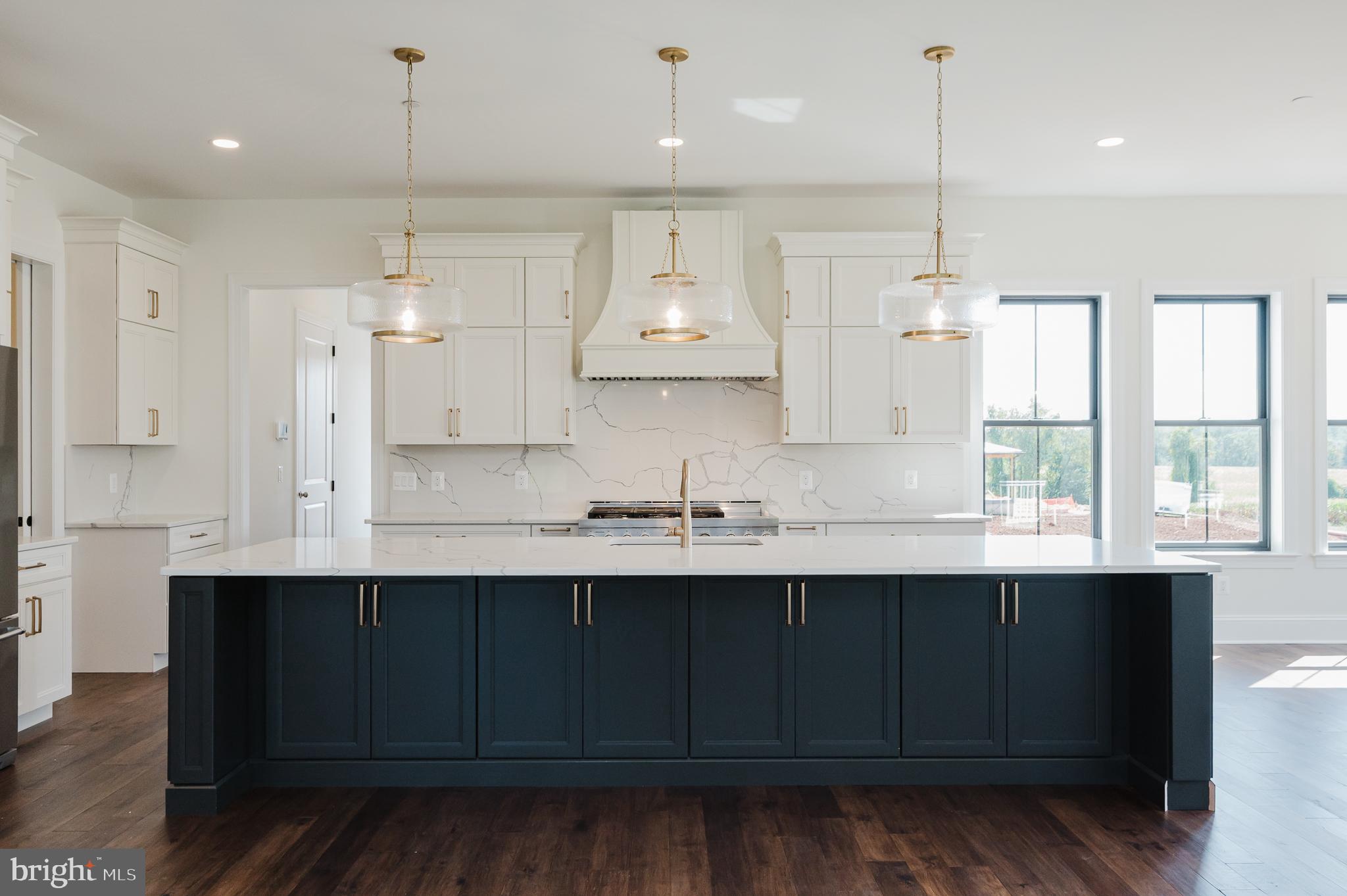 1709 Laurel Brook Road Fallston, MD 21047 - Photo 27 of 83 a kitchen with stainless steel appliances granite countertop a sink a stove and a wooden floors