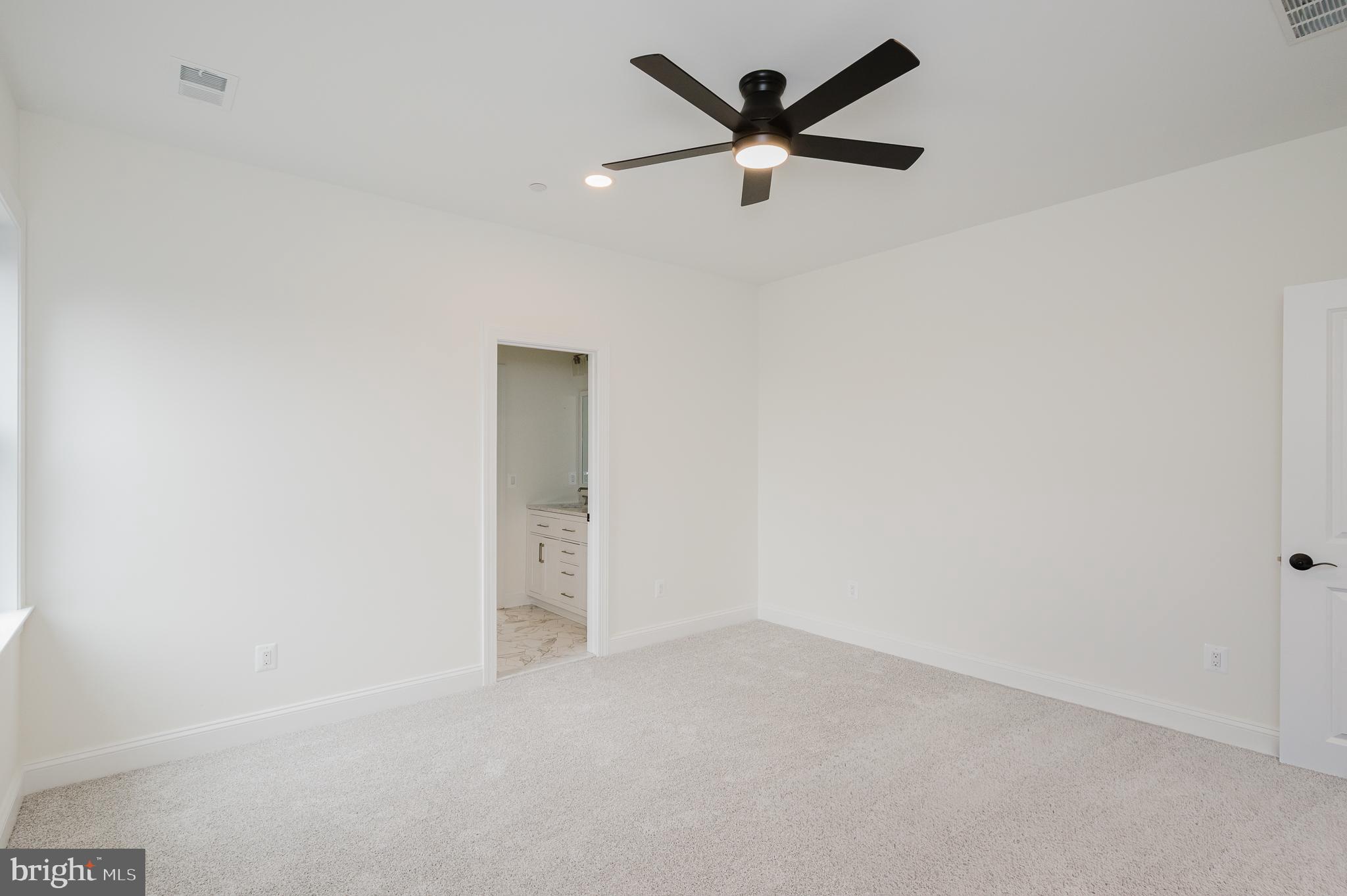 1709 Laurel Brook Road Fallston, MD 21047 - Photo 55 of 83 an empty room with a ceiling fan and a window