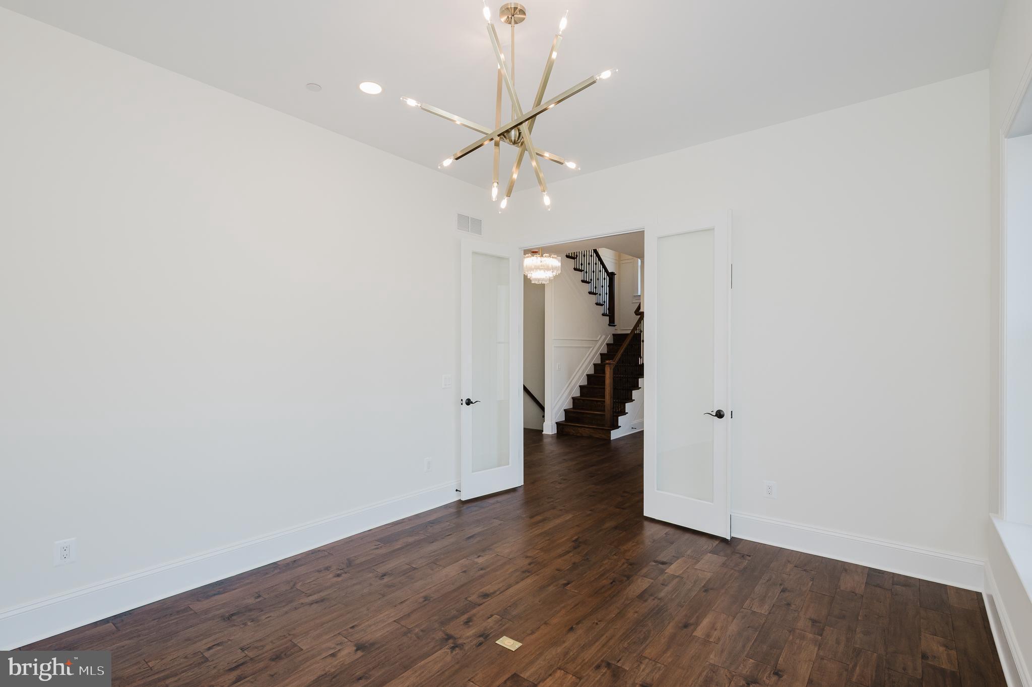 1709 Laurel Brook Road Fallston, MD 21047 - Photo 10 of 83 an empty room with wooden floor and ceiling fan
