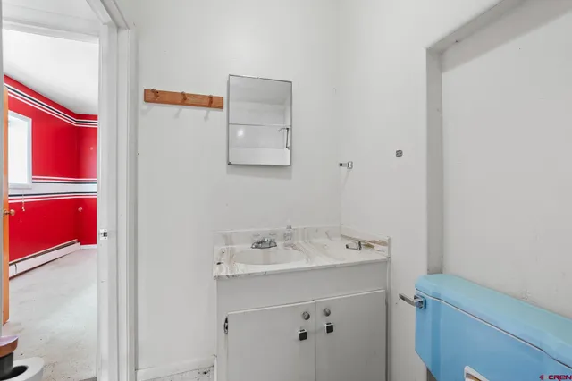 a bathroom with a sink a vanity and a mirror