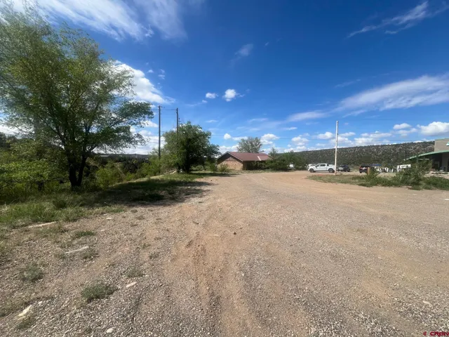 a view of a road with a yard