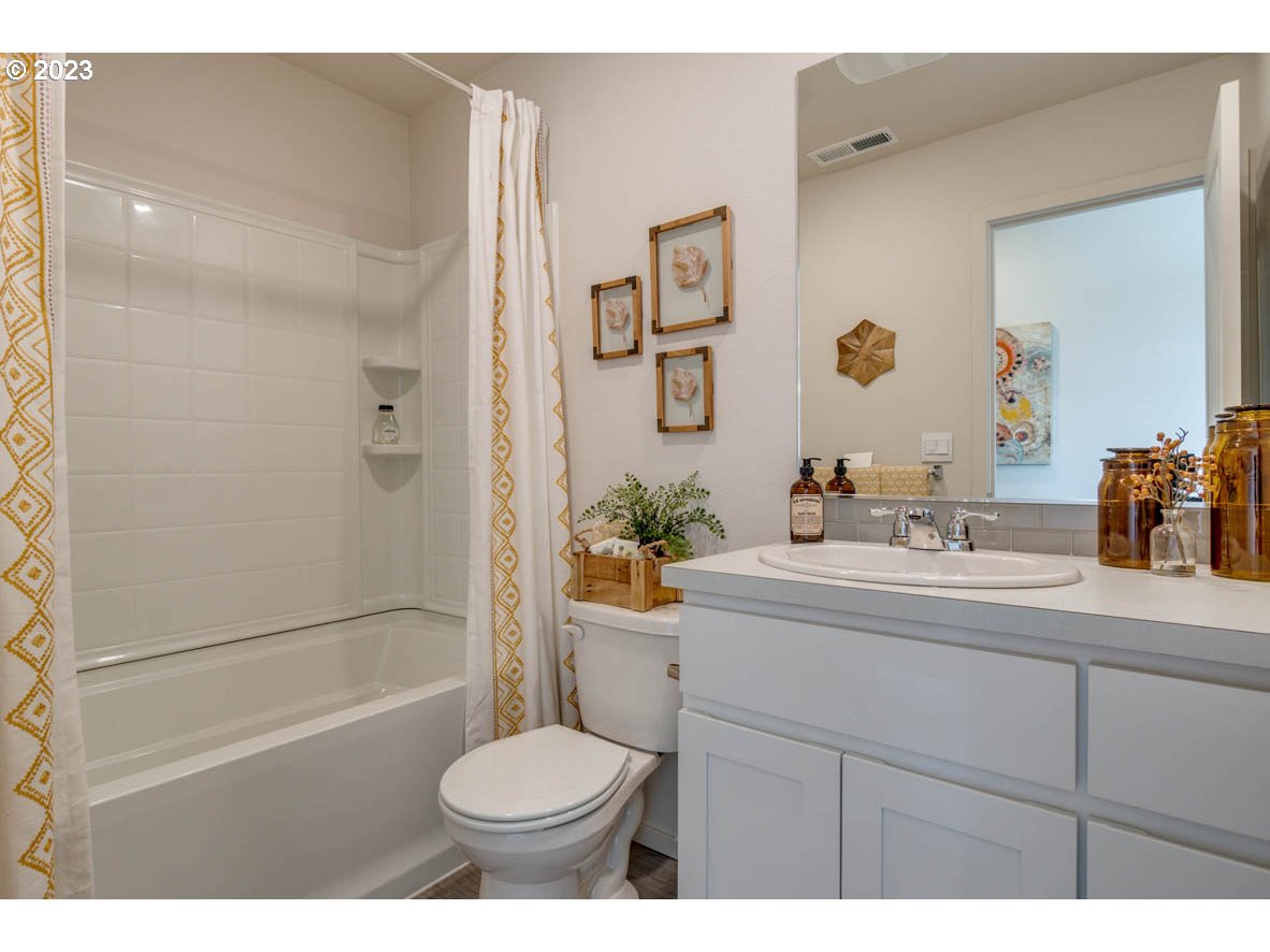 2804 Fenya Street Springfield, OR 97477 - Photo 10 of 15 a bathroom with a sink a toilet and shower