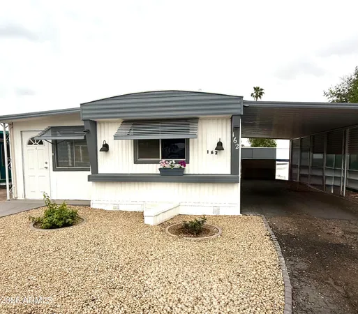 a front view of a house with a patio