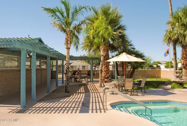 a view of swimming pool with outdoor seating