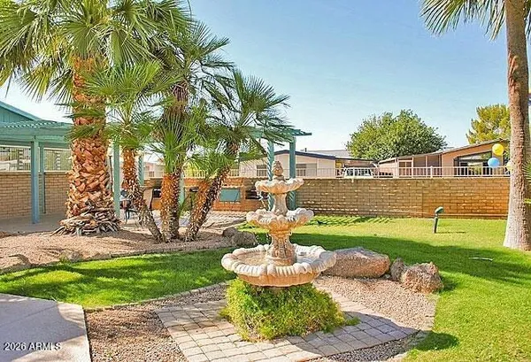 a living room with lots of chairs and a table