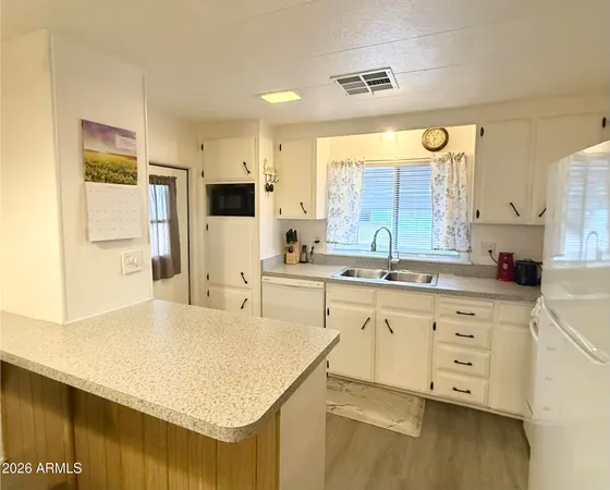 a large bathroom with a sink double vanity and a mirror