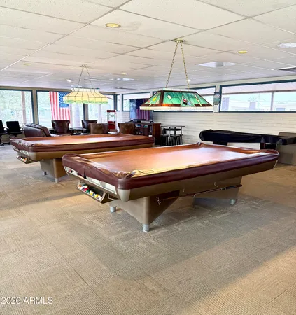 a room with gym equipment and view of living room