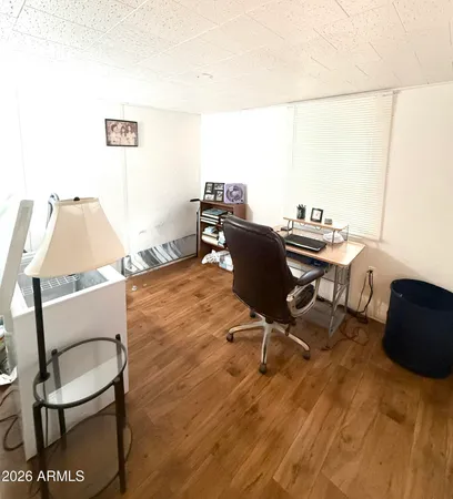 a workspace with furniture and screen